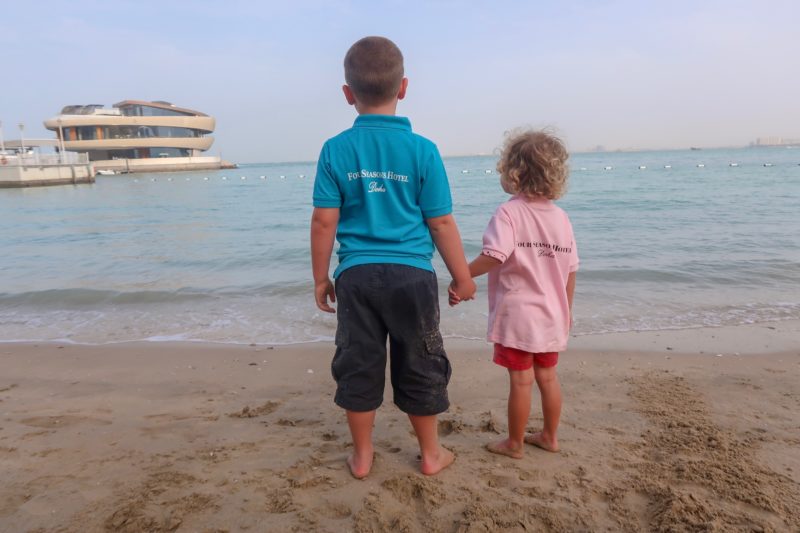 Four Seasons Doha - the Things looking out over the bay in their Four Seasons branded shirts