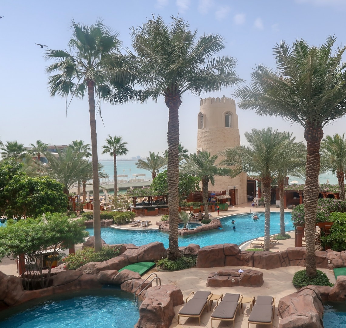 How to have an epic family holiday - pool and outside area at Four Seasons Doha