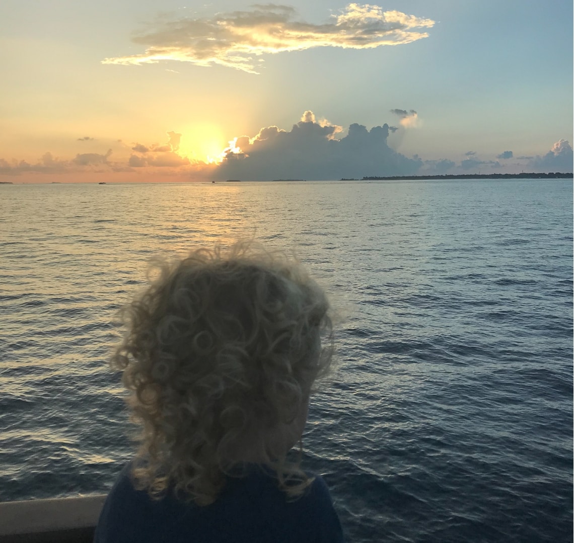 Lessons from travelling with kids - Thing 2 on a sunset cruise in the Maldives