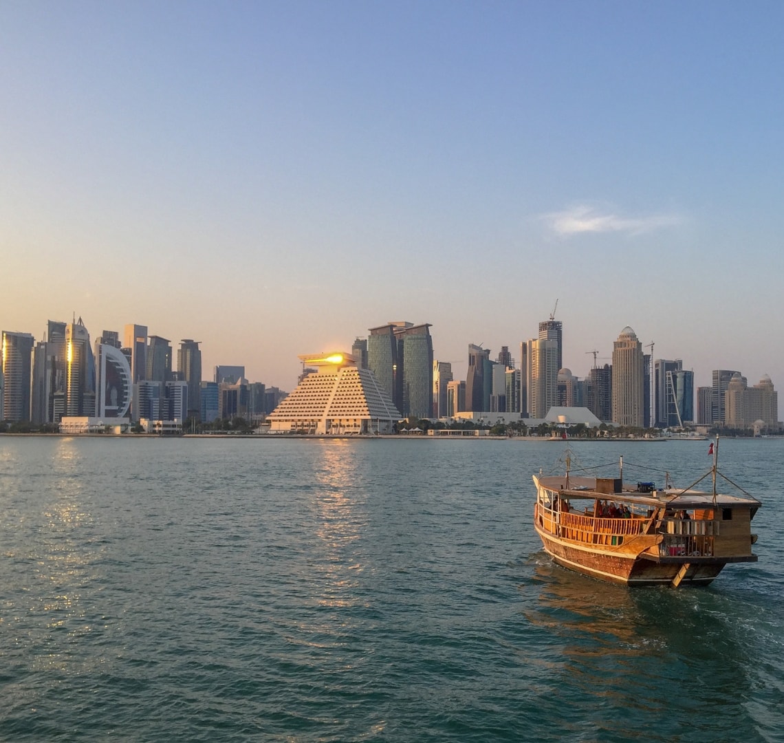 Normal Expat Christmas - View of the Doha skyline and a dhow boat from the sea