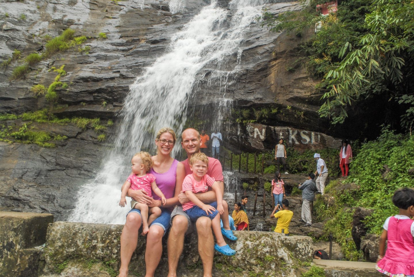 The Wanderlust and Wet Wipes family in front of a waterfall in Kerala - around 24 hours before I asked Mr Wanderlust to get us home early