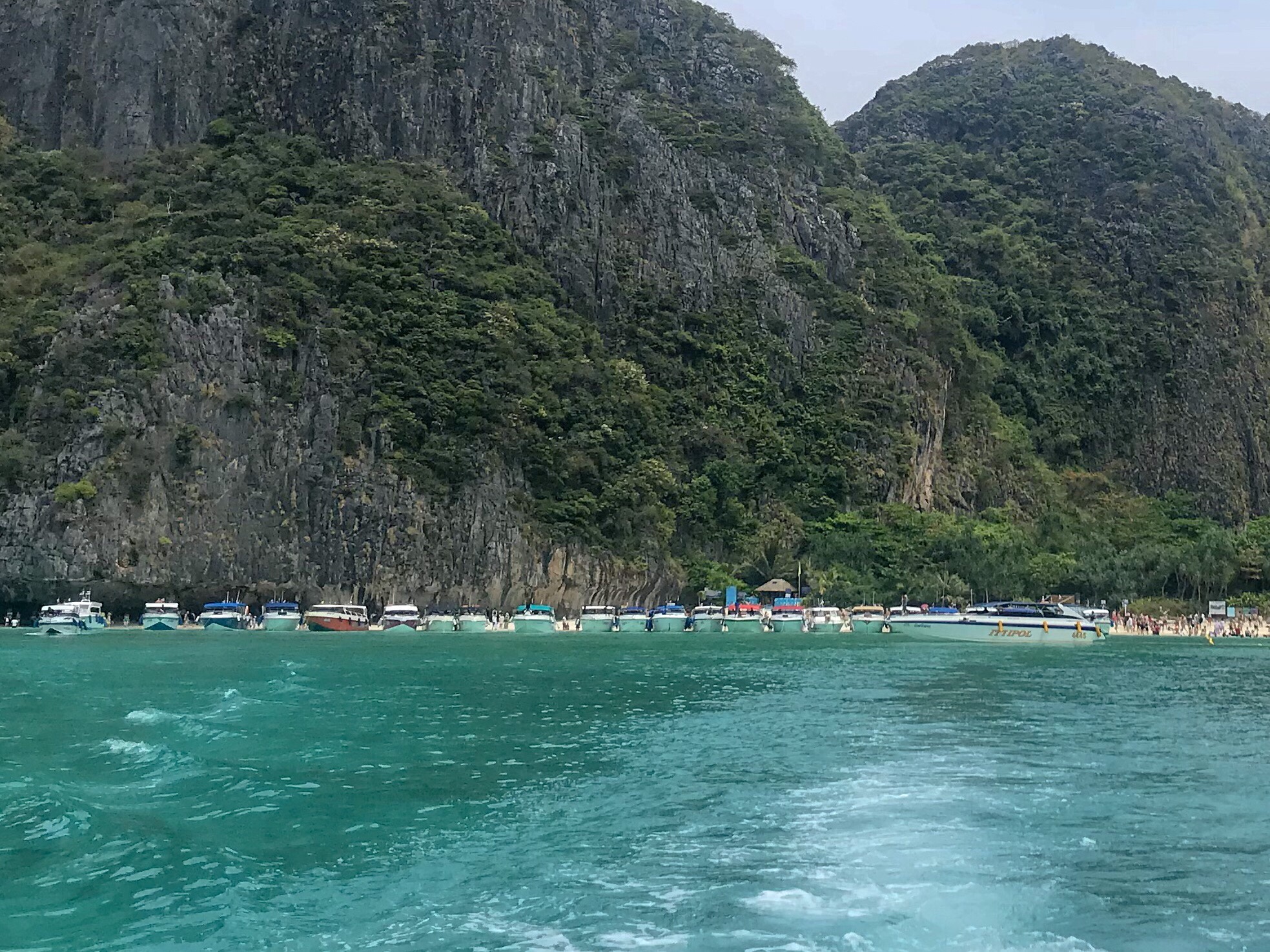 Paradise - 22 speed boats lined up off Maya Beach